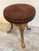 A small stool on metal gilt legs