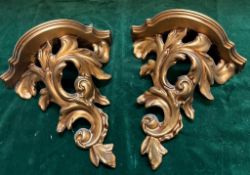 A pair of gilt resin shelves