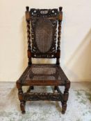 An oak gothic revival hall chair with barley twist supports and wicker seat and back