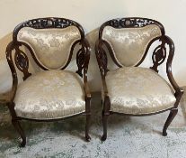 A pair of ladies and gentleman's Elbow chairs