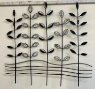 A contemporary metal wall hanging of a floral design (76cm x 71cm)