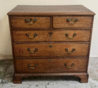 A light oak chest of drawers on bracket feet (H90cm W92cm D52cm)