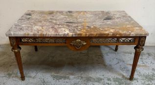 A Mid Century French rectangular variegated grey marble topped coffee table, gilt metal mounted