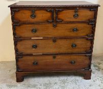A mahogany chest of drawers with carved edges on bracket feet (H111cm W110cm D48cm)