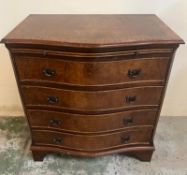 A serpentine front chest of drawers (H79cm W74cm D45cm)