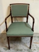 Elbow chair with green upholstery