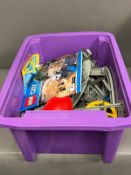 A crate of LEGO containing parts of a train set to include track, points power pack etc.