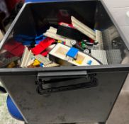 Large volume of assorted LEGO bricks, including vintage Black Police Boat Hull (Set 4010) and