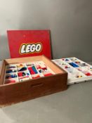 A large wooden Lego themed box, logo to lid, with two trays of vintage Lego inside