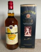 A bottle of mount Gay rum and a bottle of Cockburns VSOP Garfield Sobers Special Edition rum