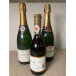A bottle of Champagne Dela Motte, a bottle of Tattinger and Royal Tokaji 1991