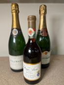 A bottle of Champagne Dela Motte, a bottle of Tattinger and Royal Tokaji 1991