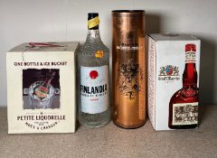 Four bottles of spirits to include a Tinladie Vodka and a Harveys Bristol cream