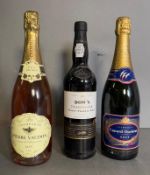 A bottle of Pierre Voudon rose champagne, a bottle of Canard Duchene 1989 and a Dows finest