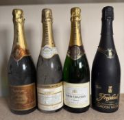 Three bottles of champagne and a bottle of cava