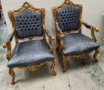 Two throne chairs with gilt scrolling frames and blue seats (H119cm W80cm D70cm)