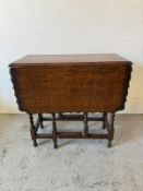 A mahogany gate leg table with barley twist legs (H72cm W104cm D75cm)