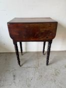 A mahogany campaign wash stand on turned legs