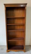 An open bookcase on bracket feet (H180cm W76cm D30cm)