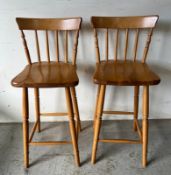A pair of pine high bar stools