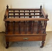 A mahogany Canterbury with three sections and finals to each corner.
