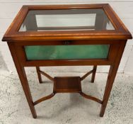 A mahogany bijouterie display table, with hinged glazed top and green baize-lined interior (H76cm
