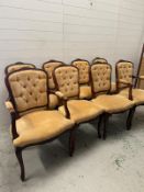 Six button back chairs and two carvers on cabriole legs