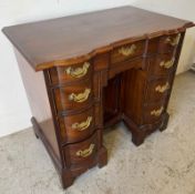 A Reproduction Chippendale style kneehole desk by Thomas Jefferson Monticello, with brass handles (