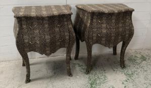 A pair of bombe fronted two drawer bedside cabinets with a snakeskin effect finish and ornate ormolu