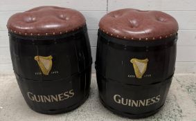 A pair of Guinness barrel stools with studded faux brown leather seats