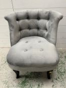Button back tub chair by Oliver Bonas