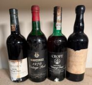 Four bottles of vintage port, a Taylors 1975, a Martinz 1970, a Croft 1970 and a Hodgson Morris