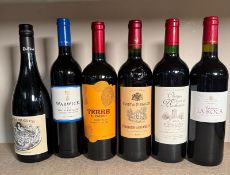 Six bottles of red wine to include a Saint Emillion, a Chateau La Rocci and a Chateau Tour De
