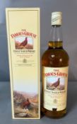 A boxed bottle of Famous Grouse blended Scotch whisky