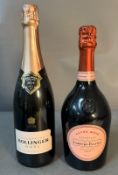 A bottle of Bollinger rose champagne and a bottle of Laurent Perrier rose champagne.