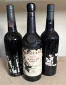A bottle of Grahams 1975 vintage port and two bottles of Taylors a 1983 and one with indistinct