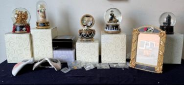 A selection of Phantom of the Opera memorabilia to include snow globes, badges and a photograph