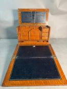 A Victorian oak writing compendium with brass handles to the sides, the fall opening to a blue