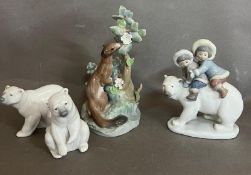 A selection of four LLadro figures: An otter and three polar bear themed figures.