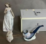 Two Lladro figures: A pipe on a stand and a lady with a parasol