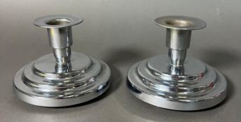 A pair of Art Deco style chrome plated squat candlesticks Height 7cm.