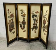 A four-panel Chinese (Hong Kong) folding black lacquer screen with floral relief stone panels (123cm
