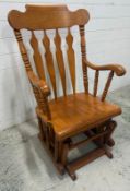 A pine Windsor style rocking chair