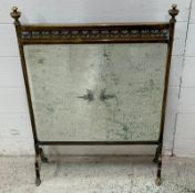 A brass mirrored fire screen with a central etched sunburst pattern (70cm x 53cm)