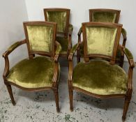 A set of four Louis XVI style armchairs upholstered in green velvet
