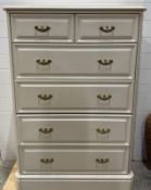 A white contemporary two over four chest of drawers (H111cm W75cm D48cm)