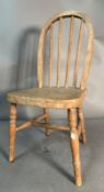 A child's pine bow backed Windsor chair