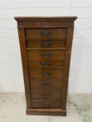 An oak Wellington chest comprising eight graduated drawers (H120cm W56cm D40cm)