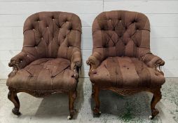 A pair of Victorian spoon and button back armchairs with carved walnut frames AF