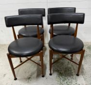 A set of four G-Plan Mid Century chairs with black seats and backs